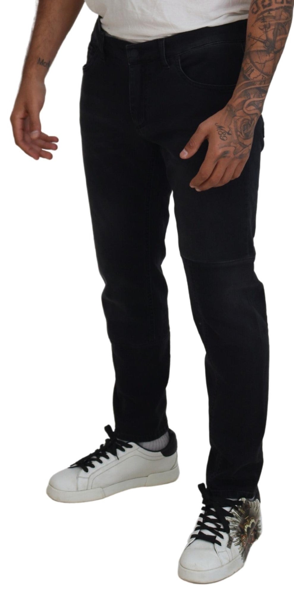 Jean skinny en denim noir Dolce & Gabbana avec broderie angel, ajusté et tendance, visible avec détails de couture.