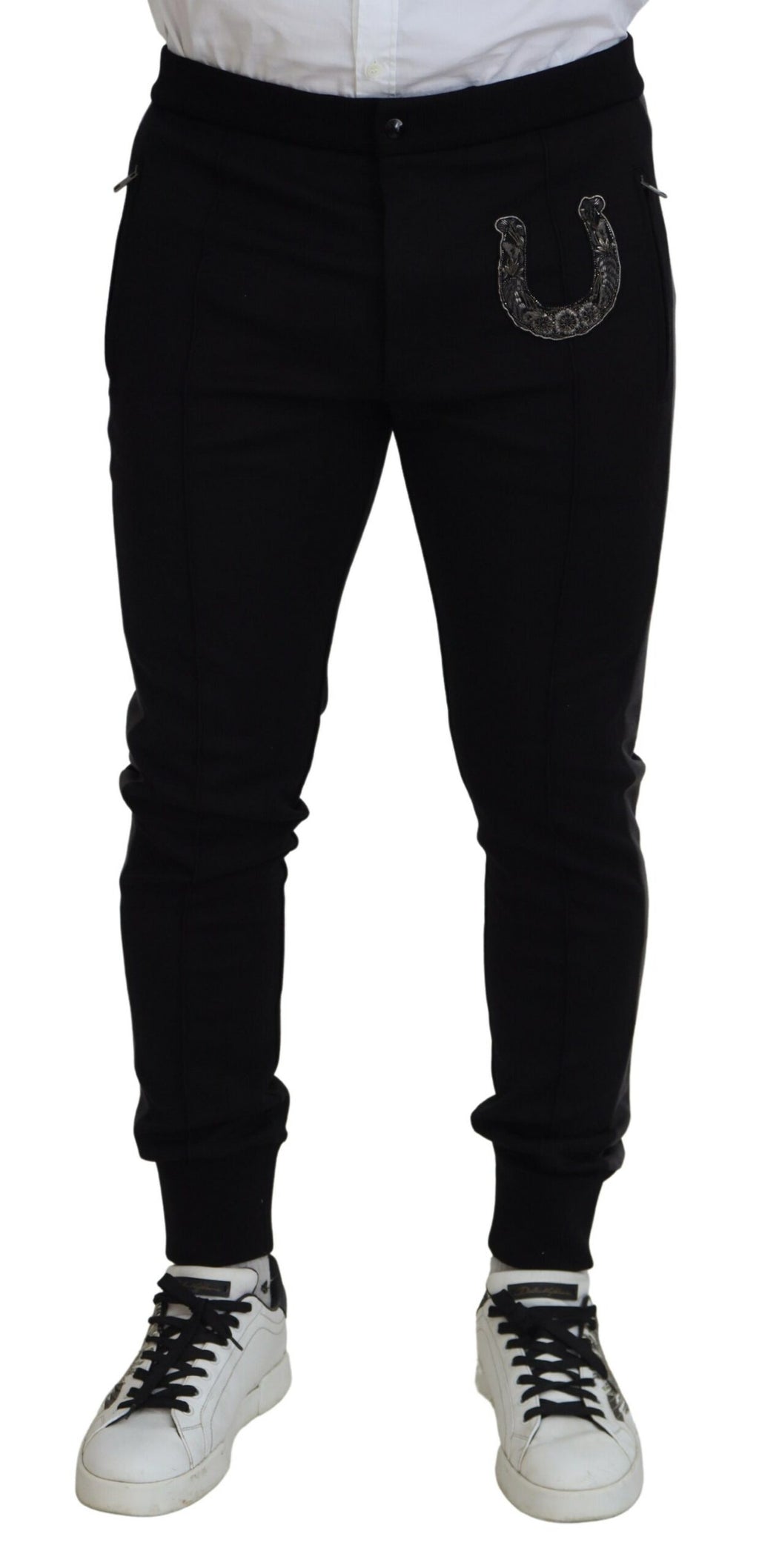 Pantalons joggers en laine noire Dolce & Gabbana avec motif de fer à cheval, style décontracté et élégant.