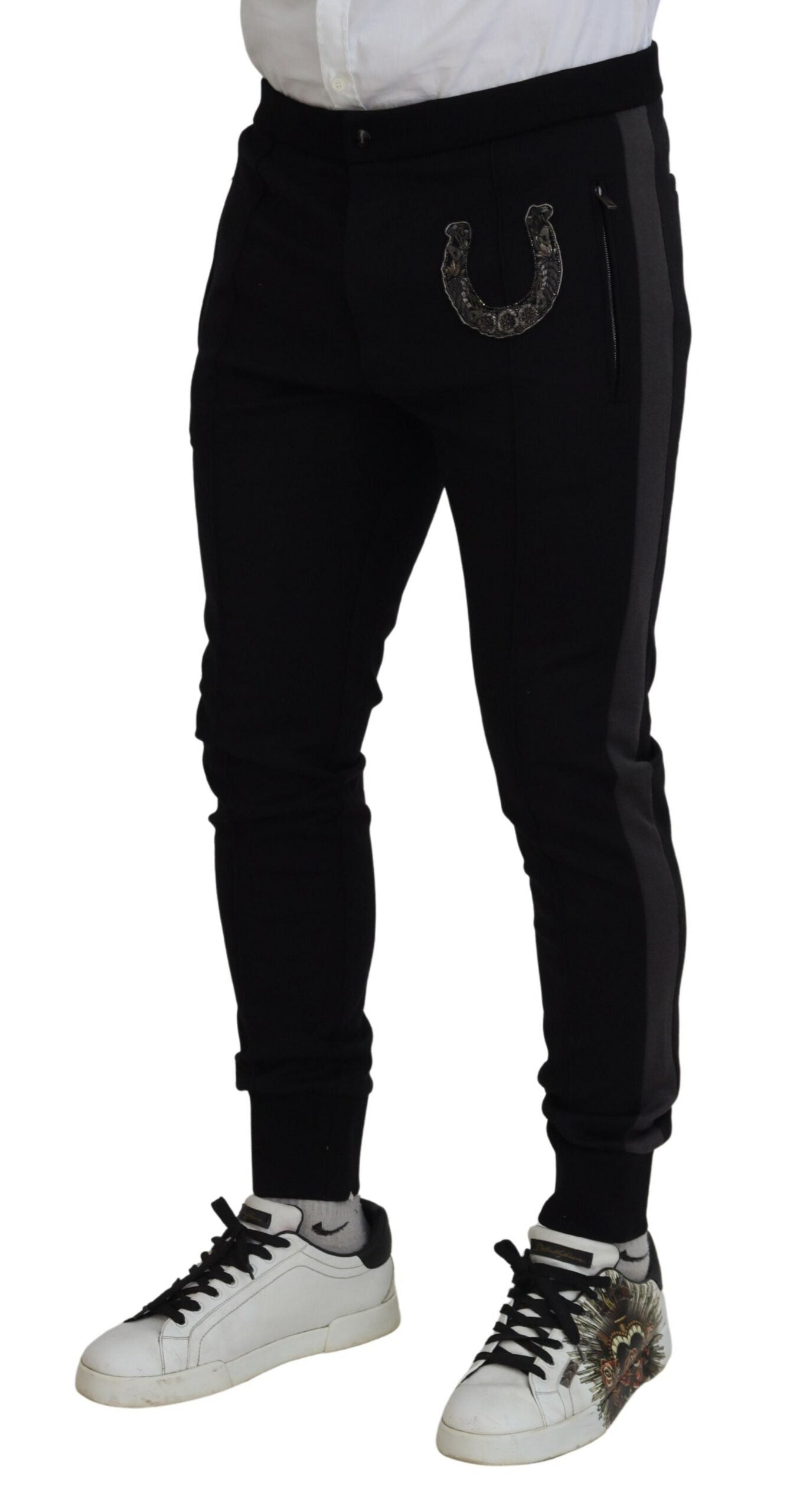 Pantalons joggers en laine noire Dolce & Gabbana avec détails en forme de fer à cheval, style décontracté et élégant.
