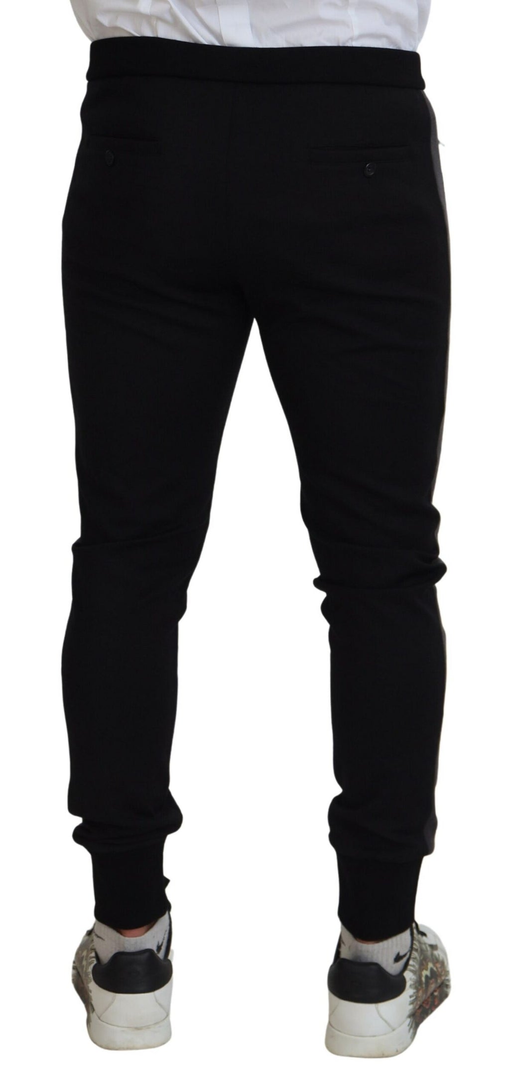 Pantalons joggers en laine noire Dolce & Gabbana avec boucle en fer à cheval, mode décontractée et élégante.