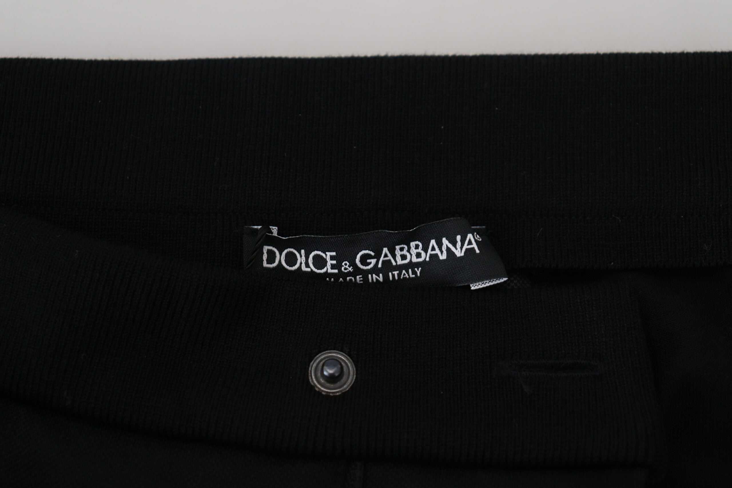 Pantalons jogger en laine noire Dolce & Gabbana avec détails en forme de fer à cheval, style décontracté et élégant.