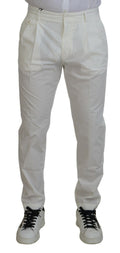 Pantalon chino skinny en coton blanc de Dolce & Gabbana, style élégant et ajusté, visible en détail dans l'image.