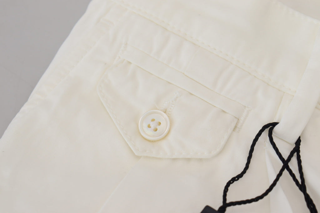 Pantalons chino skinny en coton blanc de Dolce & Gabbana, vue de face, détails élégants et coupe ajustée.