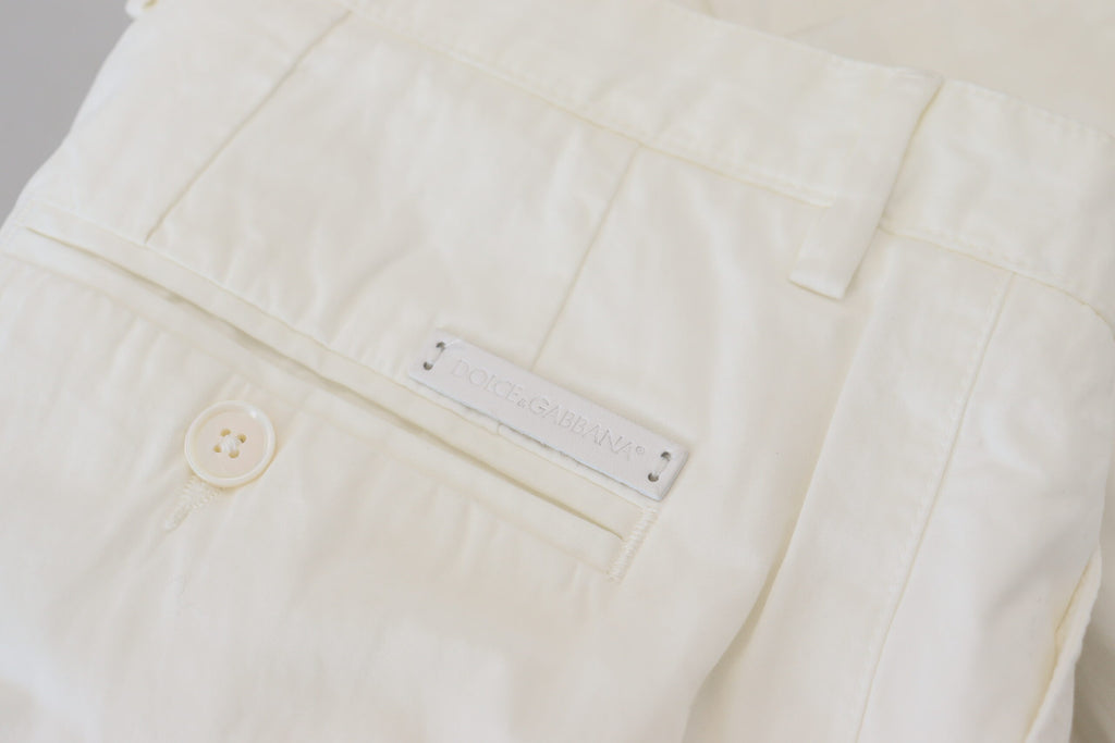 Pantalons chino Skinny en coton blanc Dolce & Gabbana, style élégant et coupe ajustée, visible avec détails de couture.
