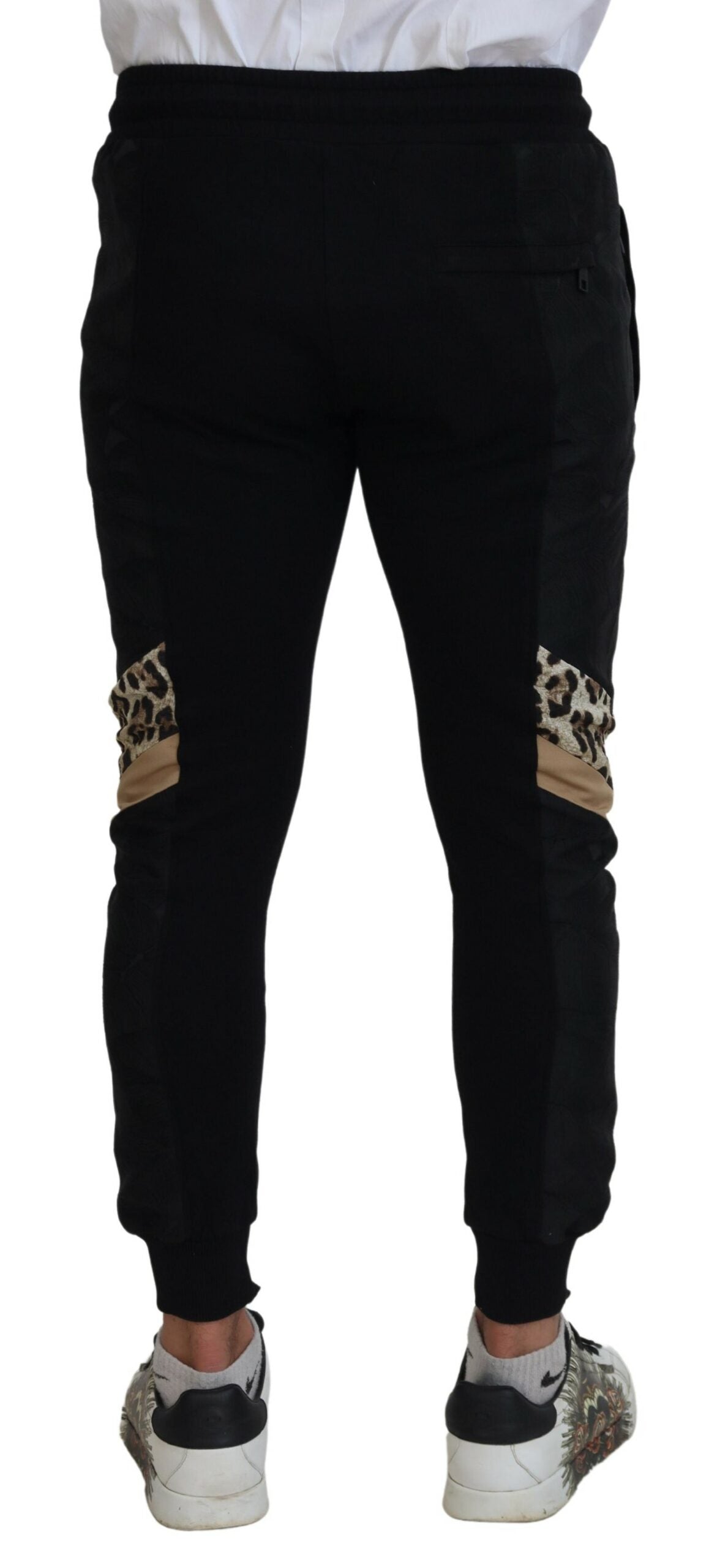 Pantalon jogging skinny noir en polyester pour homme de Dolce & Gabbana, vue de face avec détails de la coupe ajustée.