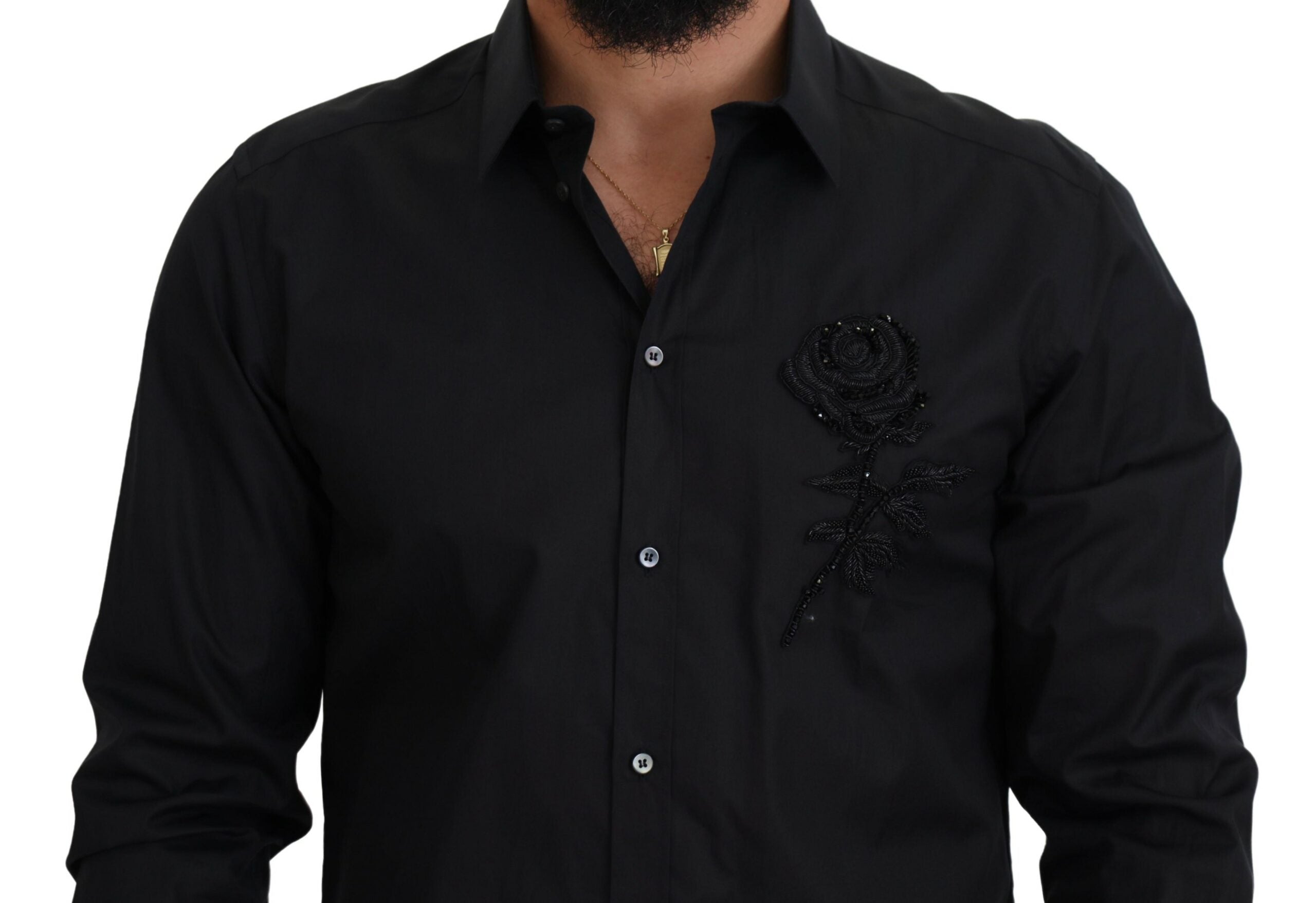 Chemise noire Dolce & Gabbana à roses, coupe slim, en coton avec motif floral élégant, visible sur l'image.