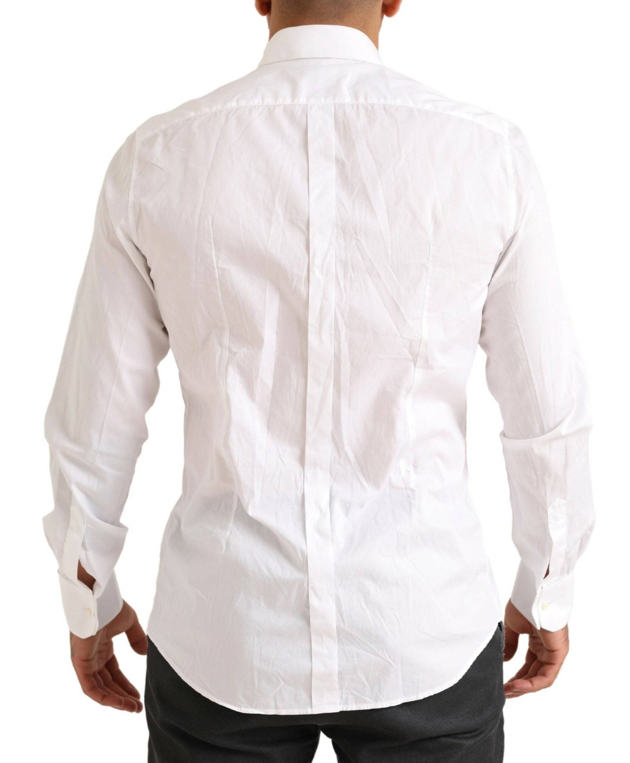 Chemise de smoking en coton blanc Dolce & Gabbana avec détails dorés, élégante chemise formelle pour femme.