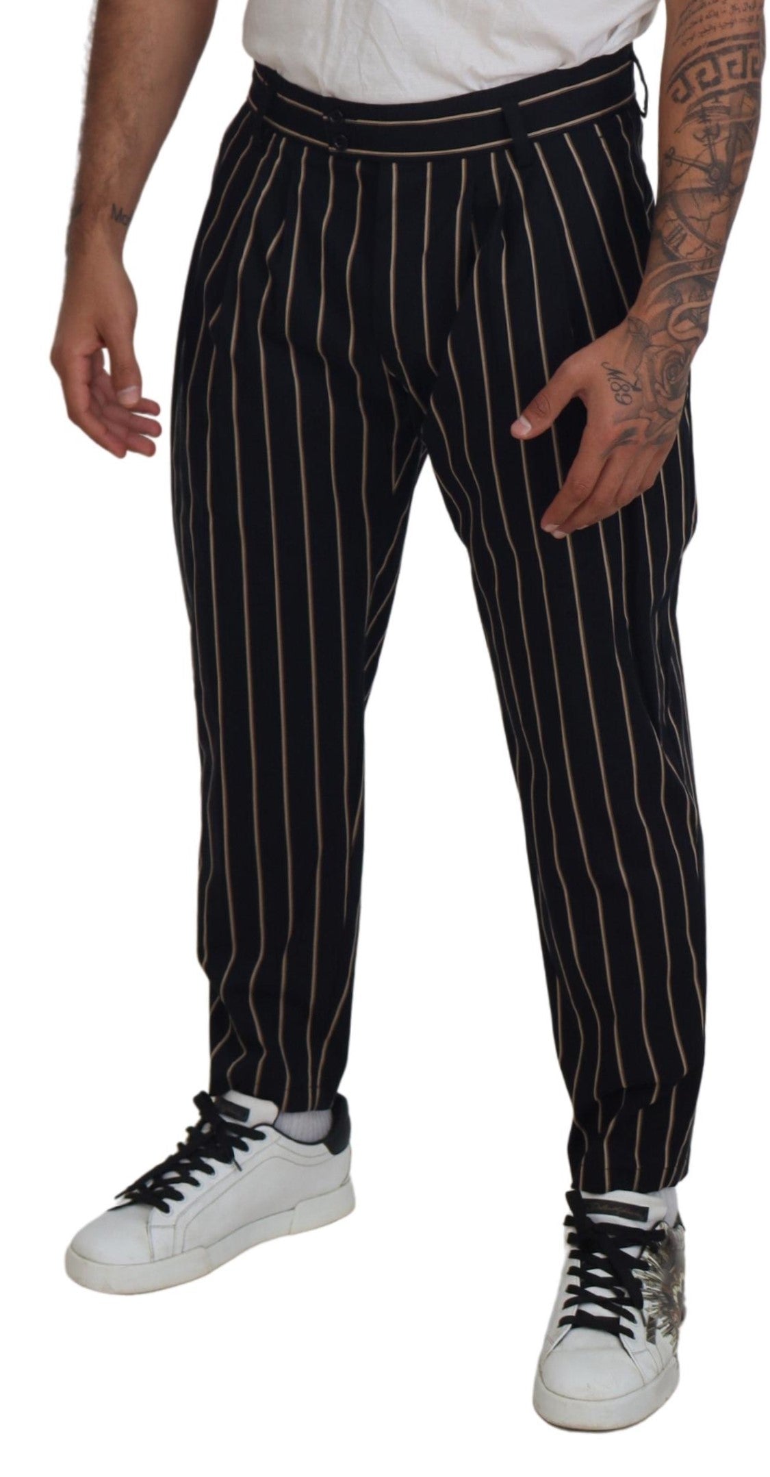 Pantalons en coton extensible à rayures noires et beiges de Dolce & Gabbana, coupe ajustée et style élégant.