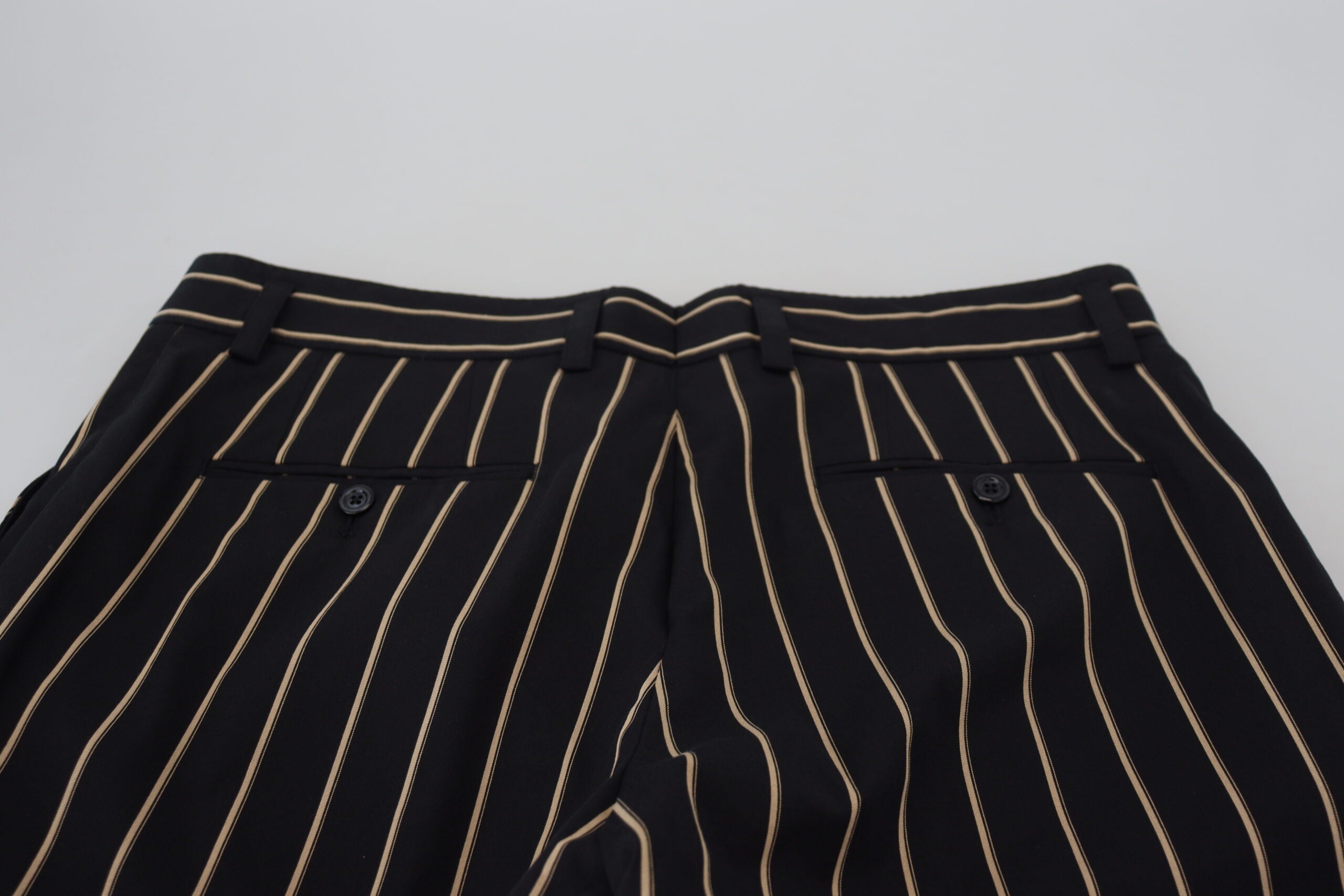 Pantalons en coton stretch noirs et beiges à rayures de Dolce & Gabbana, mode élégante et confortable pour femme.