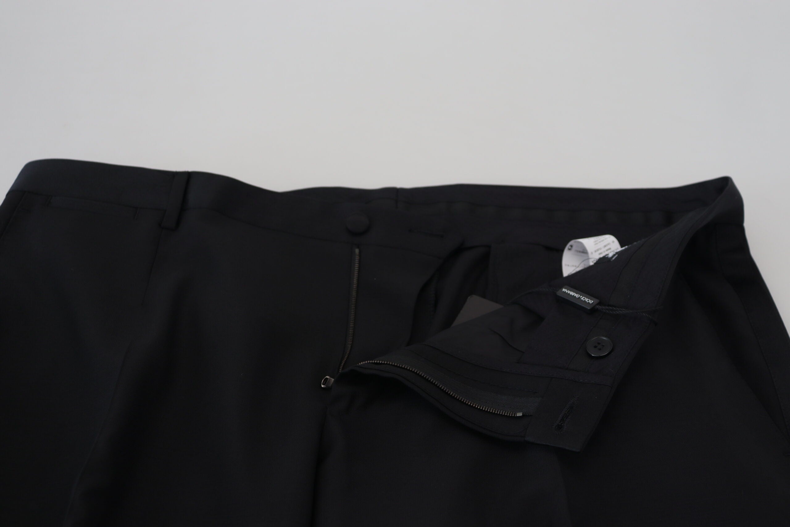 Pantalon en laine et soie noir Dolce & Gabbana, style élégant avec coupe ajustée et détails sophistiqués.
