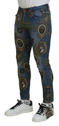 Jeans slim en coton avec motif médaille bleu de Dolce & Gabbana, coupe ajustée et détails élégants.