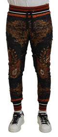Pantalons de sport Dolce & Gabbana en soie grise avec motif baroque, style élégant et sophistiqué.