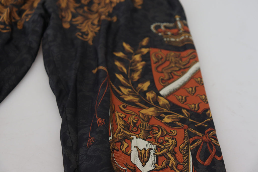 Pantalons de sport Dolce & Gabbana en soie grise à motif baroque, style élégant et luxueux pour homme.