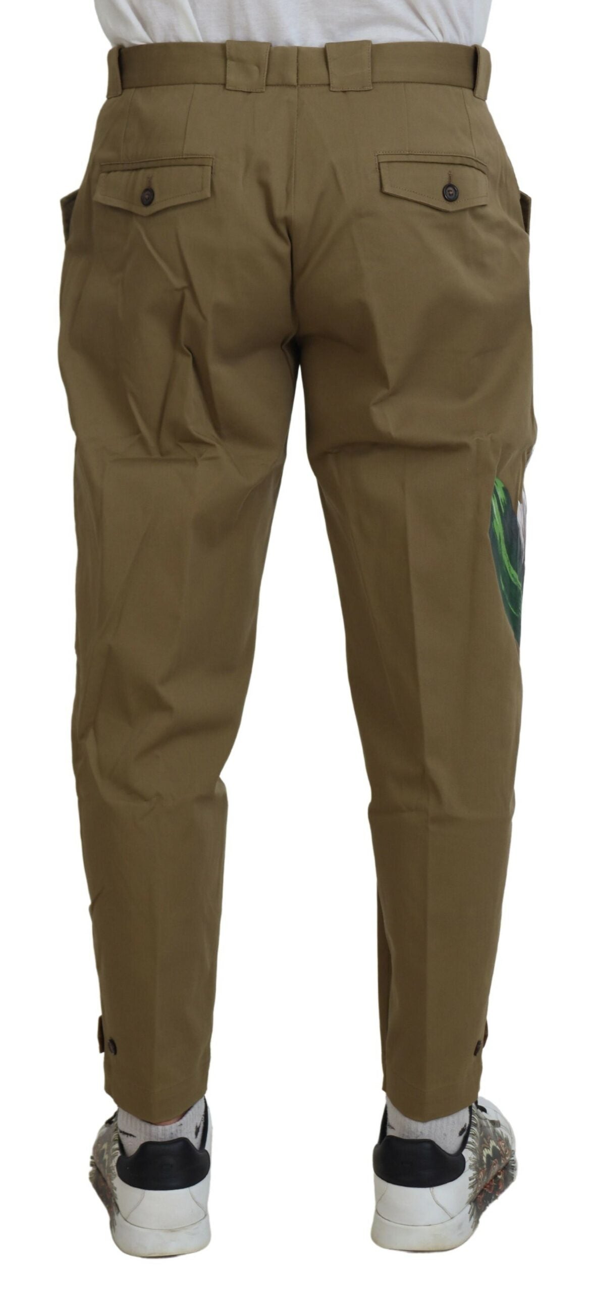 Pantalon chino Dolce & Gabbana beige en coton stretch avec motif floral, élégant et confortable pour homme.