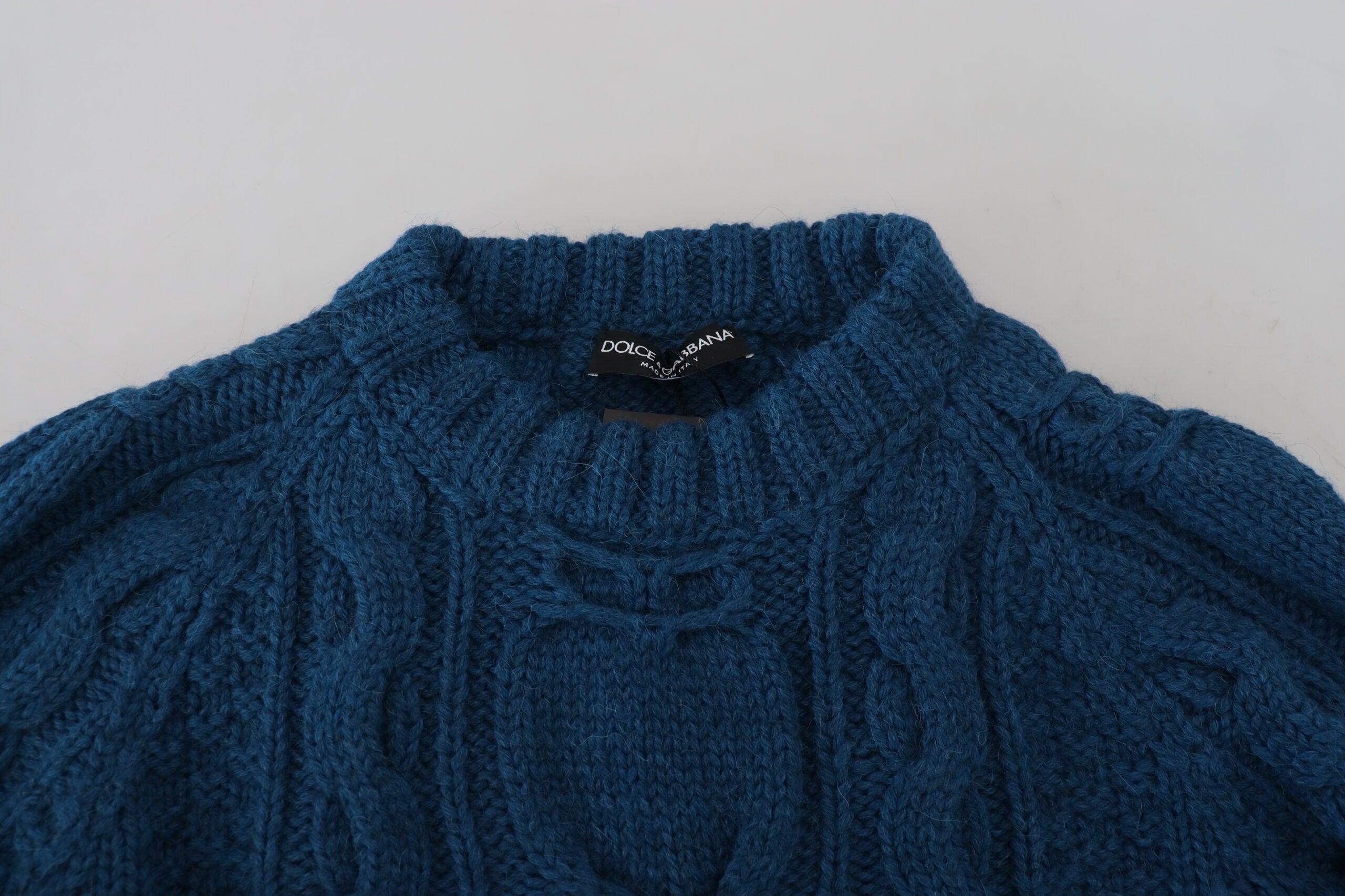 Pull en laine alpaga bleu Dolce & Gabbana, tricoté, avec un design élégant et confortable.
