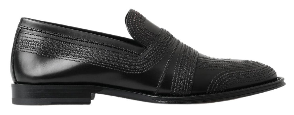 Chaussures mocassins en cuir noir Dolce & Gabbana avec couture visible, style élégant et classique.