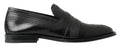 Chaussures mocassins en cuir noir Dolce & Gabbana avec couture visible, style élégant et classique.