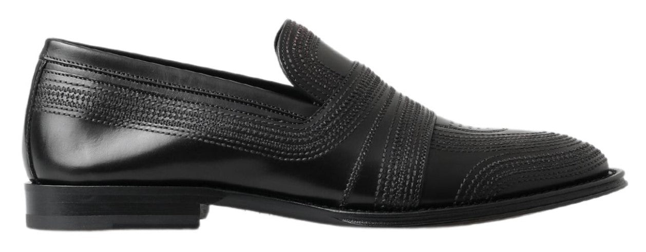Chaussures mocassins en cuir noir Dolce & Gabbana avec couture visible, style élégant et classique.