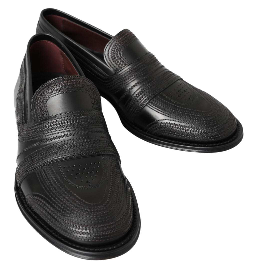 Chaussures mocassins en cuir noir Dolce & Gabbana, slippers en cuir avec surpiqûres, vues de face.