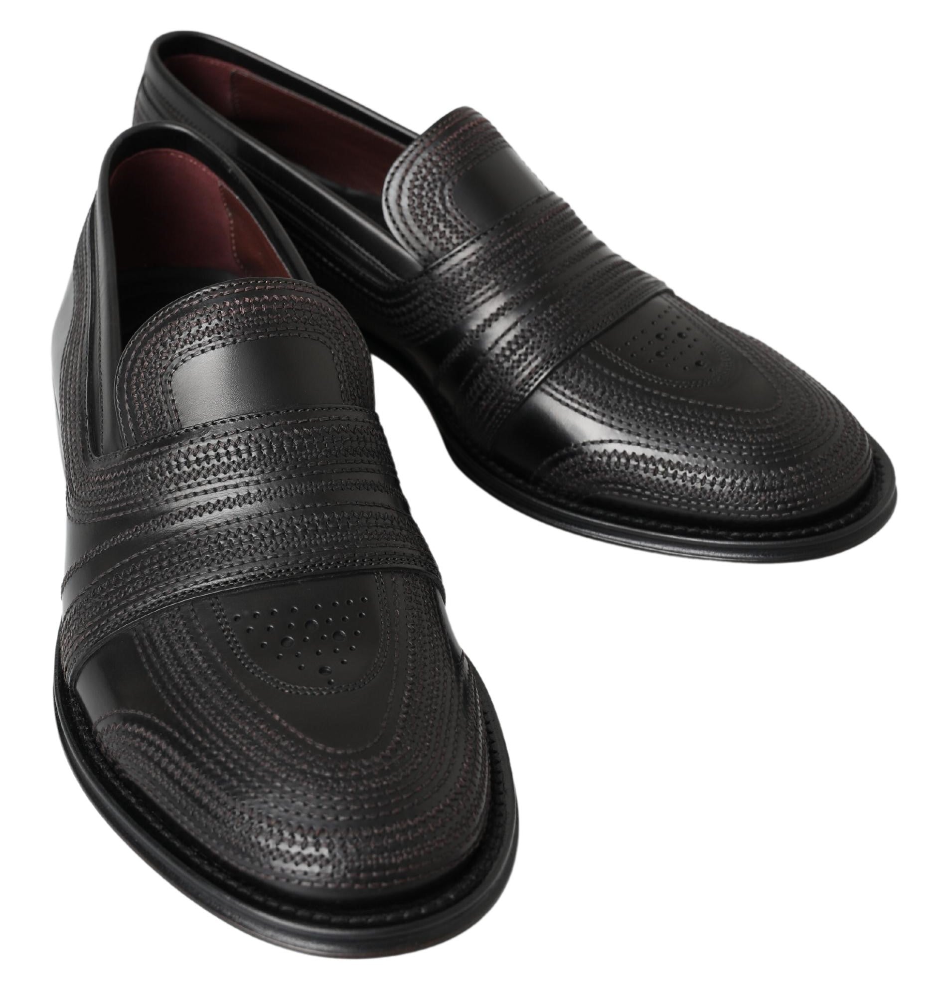 Chaussures mocassins en cuir noir Dolce & Gabbana, slippers en cuir avec surpiqûres, vues de face.