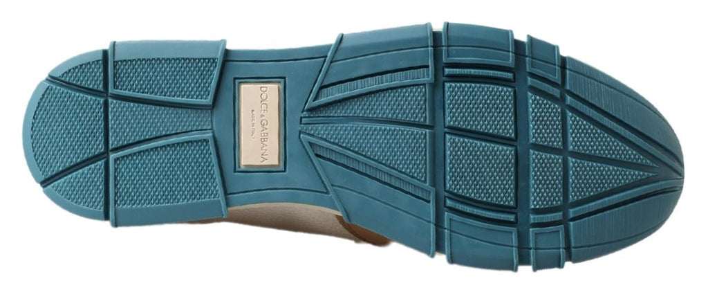 Chaussures mocassins en cuir blanc de Dolce & Gabbana, loafers élégants pour homme ou femme, avec finition raffinée.