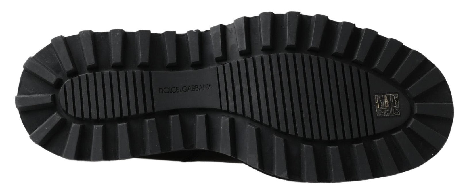 Bottes noires en cuir stretch à enfiler de Dolce & Gabbana, style élégant et moderne, visibles dans l'image.