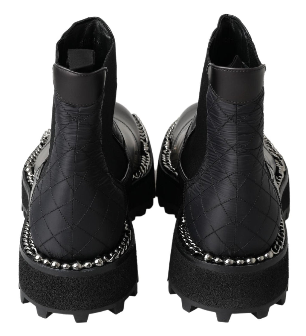 Bottes noires en cuir stretch à enfiler Dolce & Gabbana, silhouette élégante et sophistiquée pour femmes.