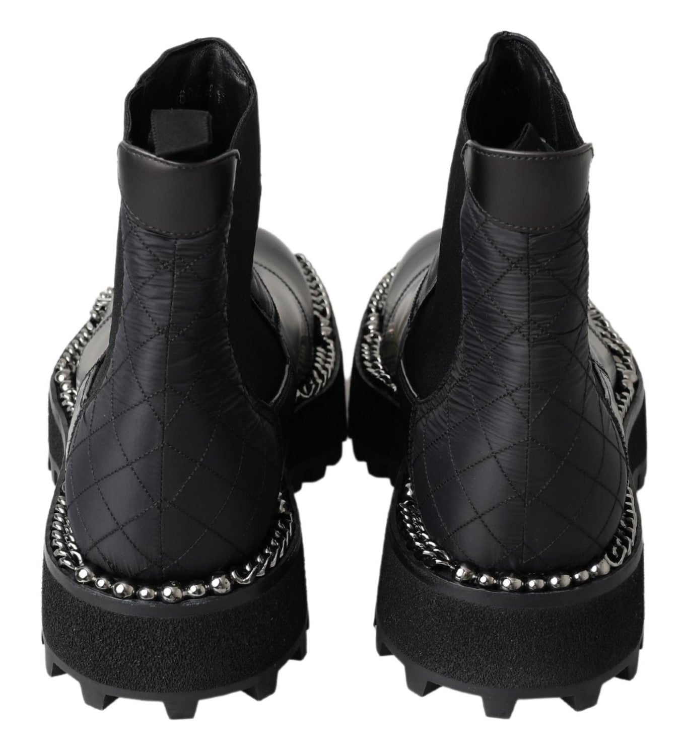 Bottes noires en cuir stretch à enfiler Dolce & Gabbana, silhouette élégante et sophistiquée pour femmes.