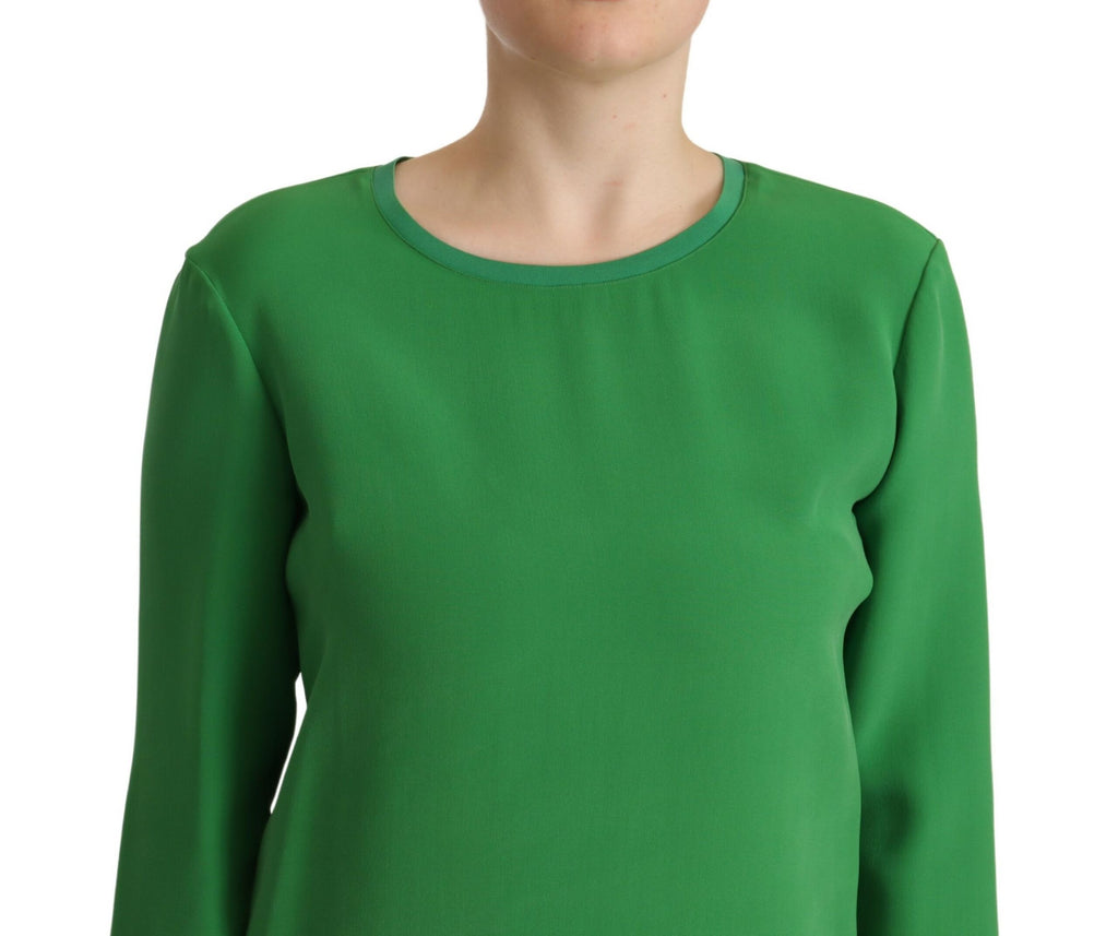 Pull en soie verte Armani à manches longues et col rond, élégant et confortable, visible sur l'image.