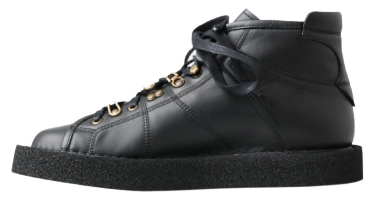 Bottes noires en cuir extensible de Dolce & Gabbana, style slip-on, avec design élégant et finition sophistiquée.