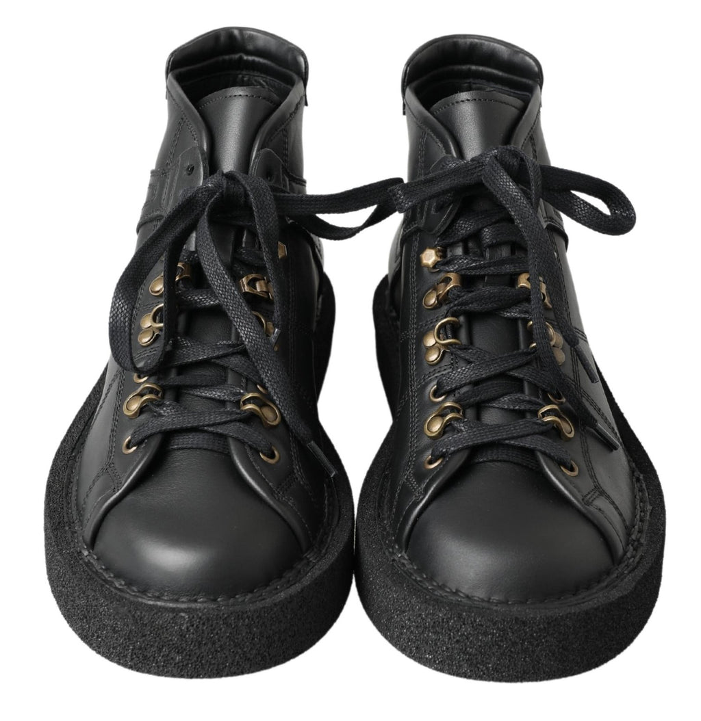 Bottes noires en cuir stretch sans lacets de la marque Dolce & Gabbana, style slip-on, visibles en image.