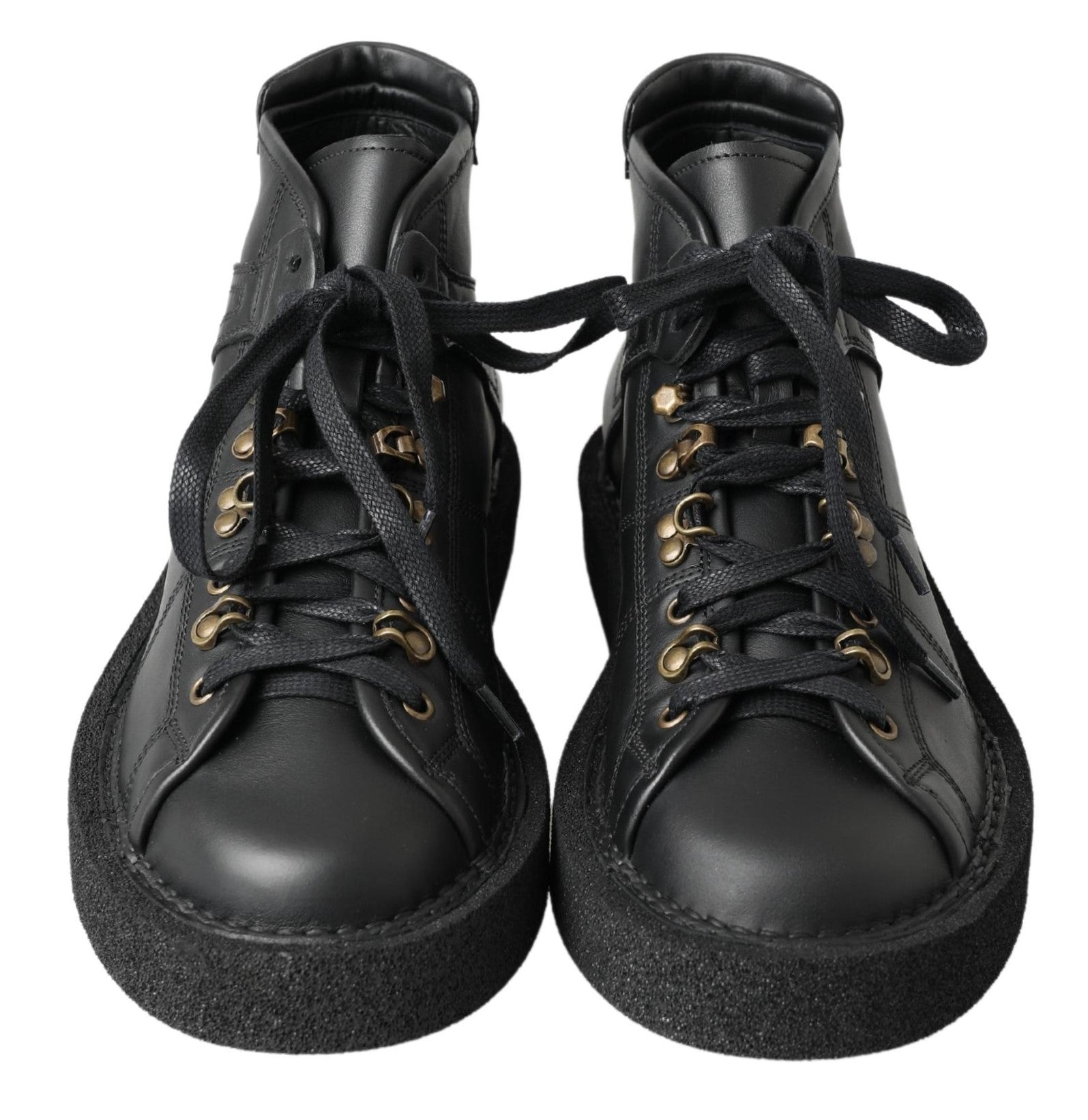 Bottes noires en cuir stretch sans lacets de la marque Dolce & Gabbana, style slip-on, visibles en image.