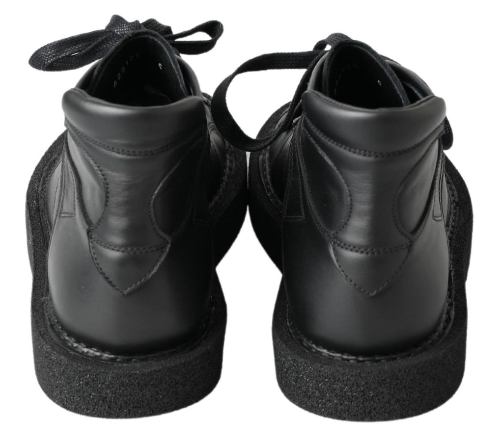 Bottes noires en cuir extensible Dolce & Gabbana, style slip-on, avec finition élégante et semelle en caoutchouc.