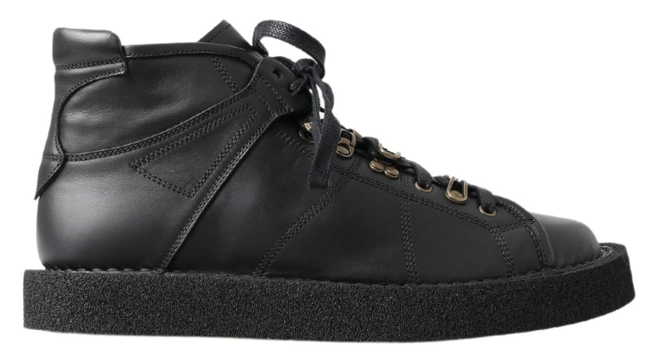 Bottes noires en cuir extensible de Dolce & Gabbana, style slip-on, avec finition élégante et semelle solide.