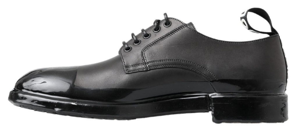 Chaussures derby en cuir noir Dolce & Gabbana, élégantes et classiques, avec lacets et finition soignée.