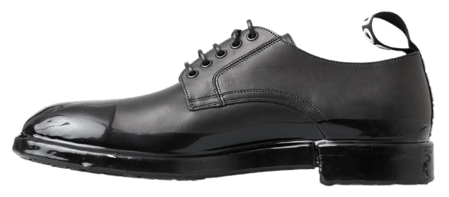 Chaussures derby en cuir noir Dolce & Gabbana, élégantes et classiques, avec lacets et finition soignée.
