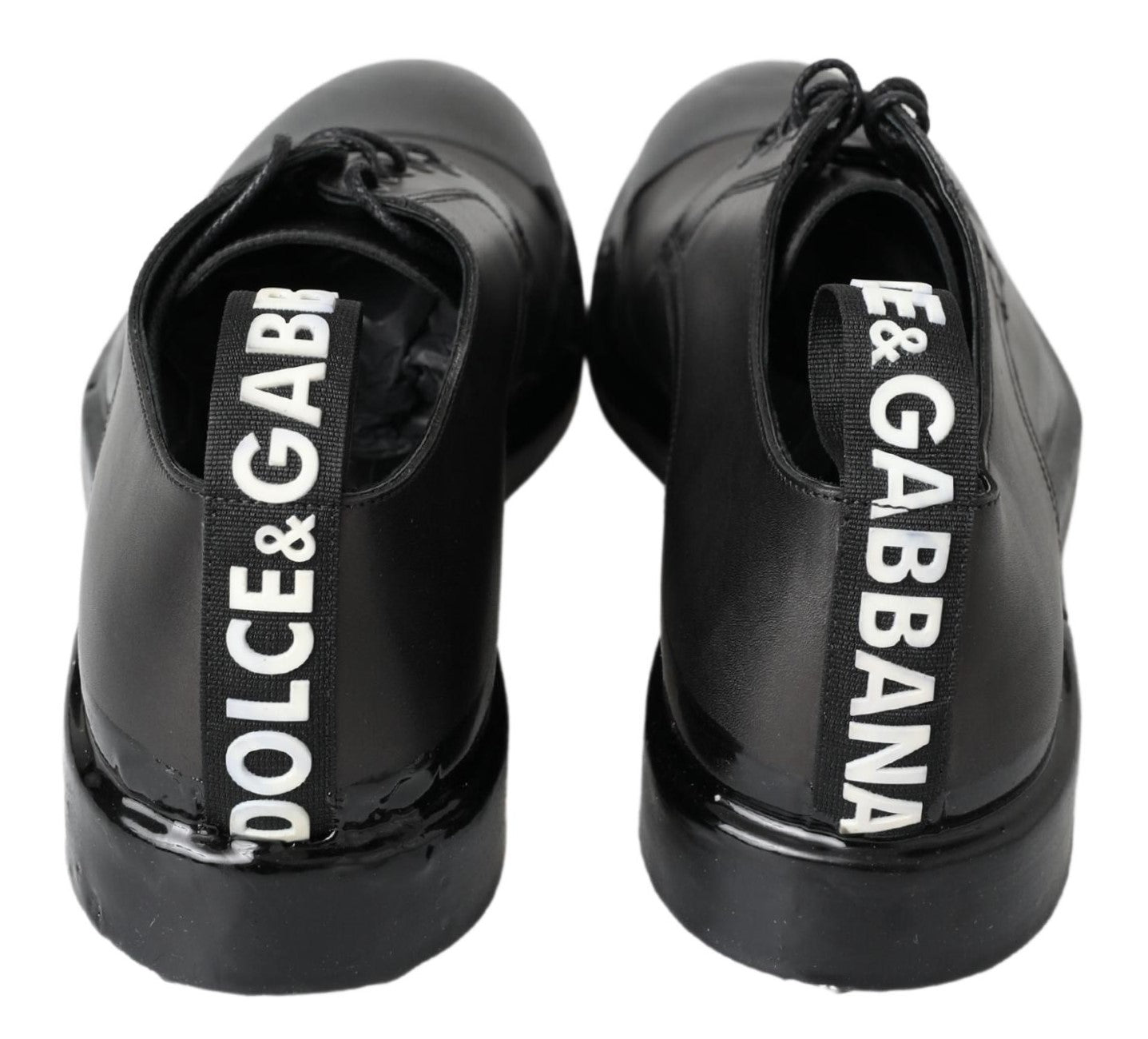 Chaussures Derby en cuir noir Dolce & Gabbana pour homme, élégantes et classiques, visibles en gros plan dans l'image.