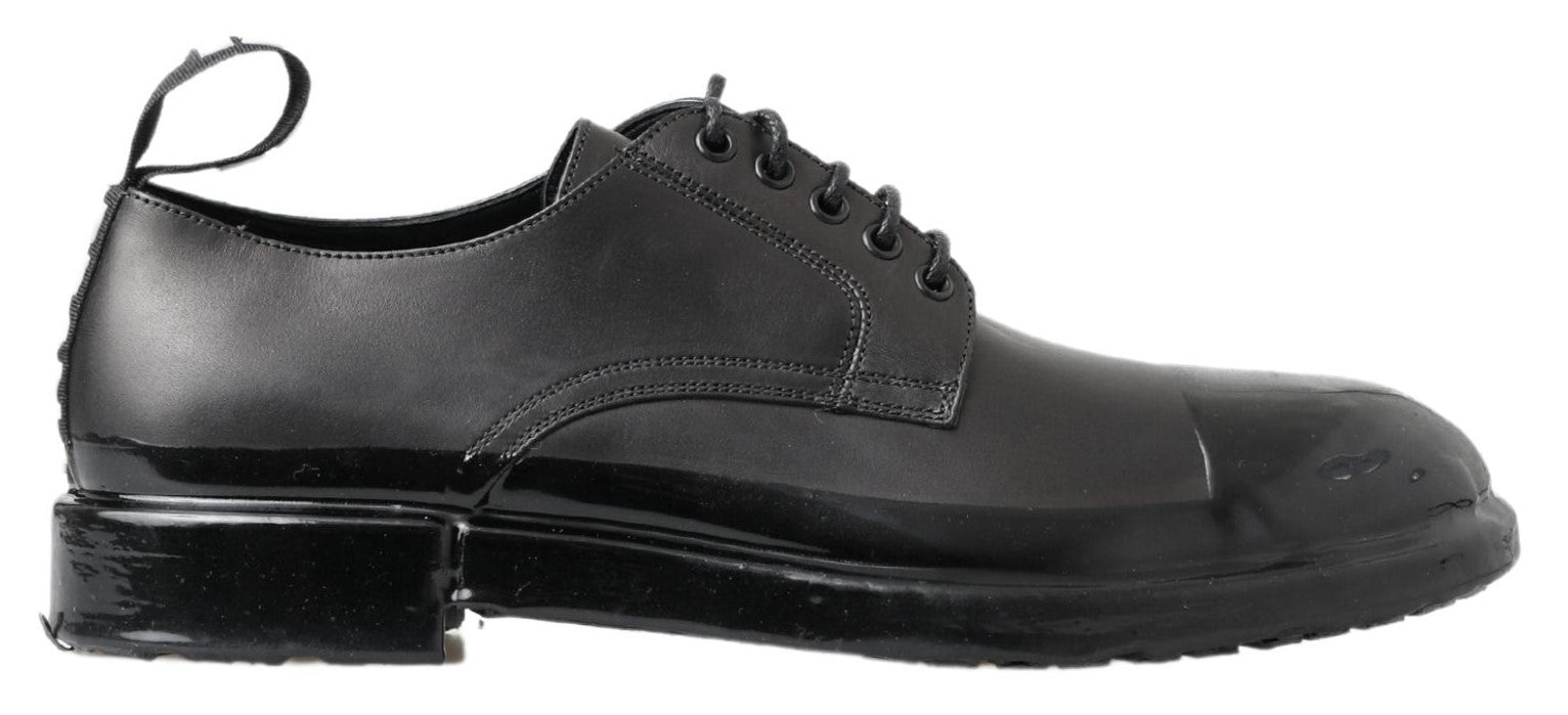 Chaussures Derby en cuir noir de Dolce & Gabbana, élégantes et sophistiquées pour hommes.