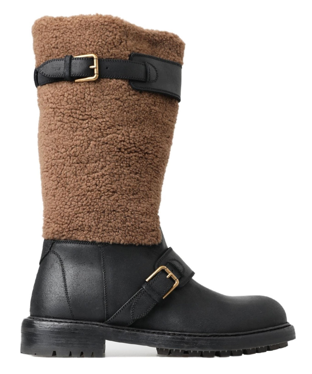 Bottes en cuir noir et shearling marron de Dolce & Gabbana, style élégant et chaud, visibles en gros plan.