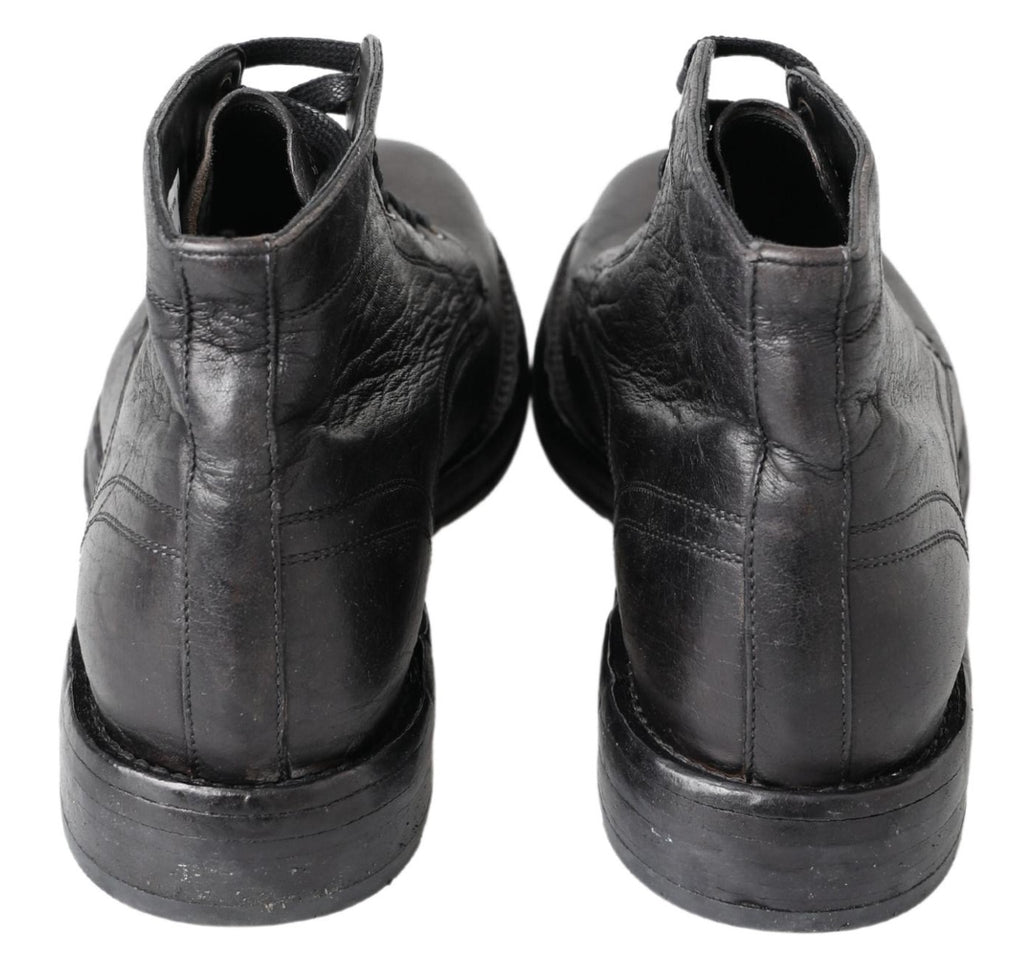 Bottes en cuir noir Dolce & Gabbana Horse Perugino avec détails élégants et semelle en caoutchouc, vue de côté.