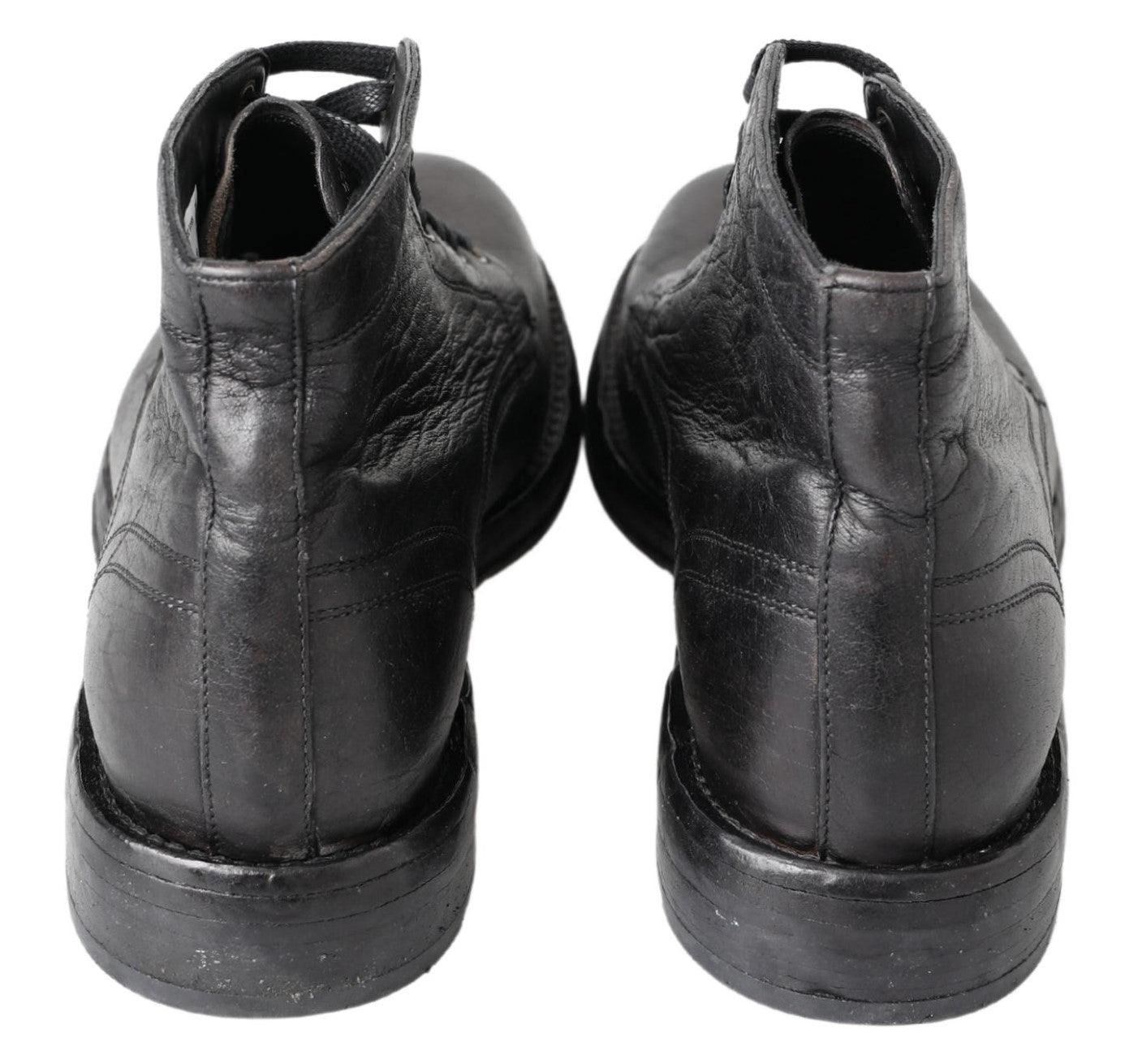 Bottes en cuir noir Dolce & Gabbana Horse Perugino avec détails élégants et semelle en caoutchouc, vue de côté.