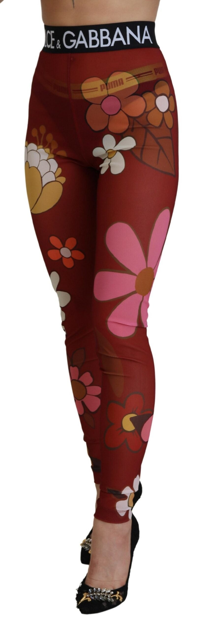 Leggings fleuries rouges Dolce & Gabbana avec taille extensible, pantalon stretch élégant et confortable.