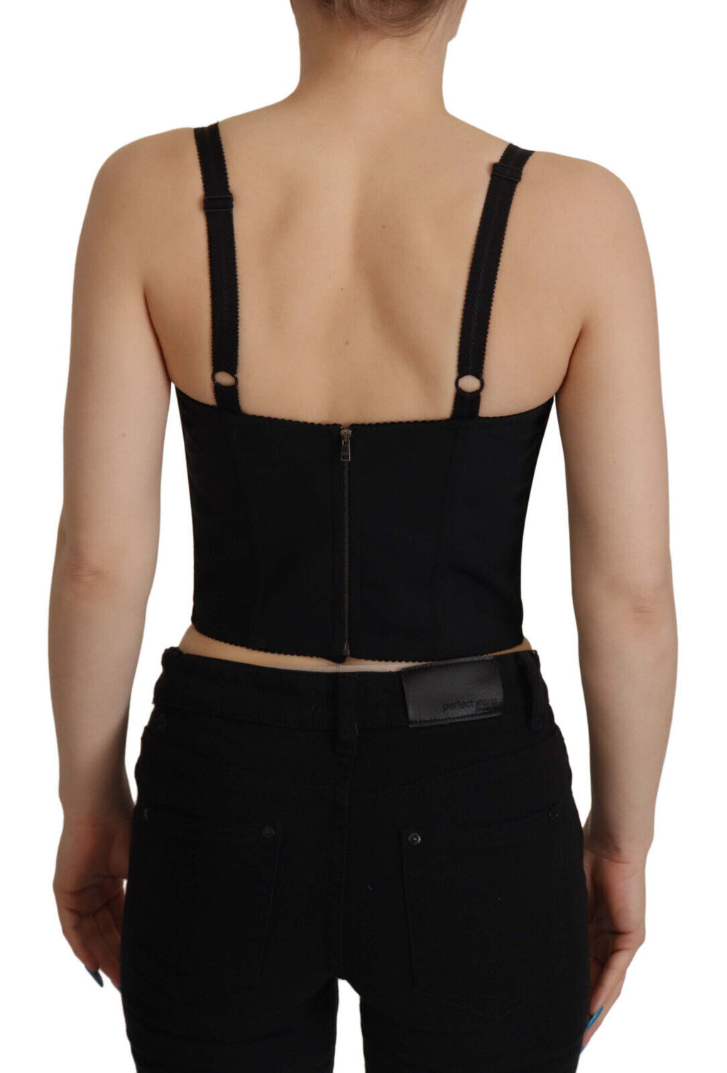 Blouse Dolce & Gabbana en patchwork noir avec corset et style crop top, détails élégants visibles sur l'image.