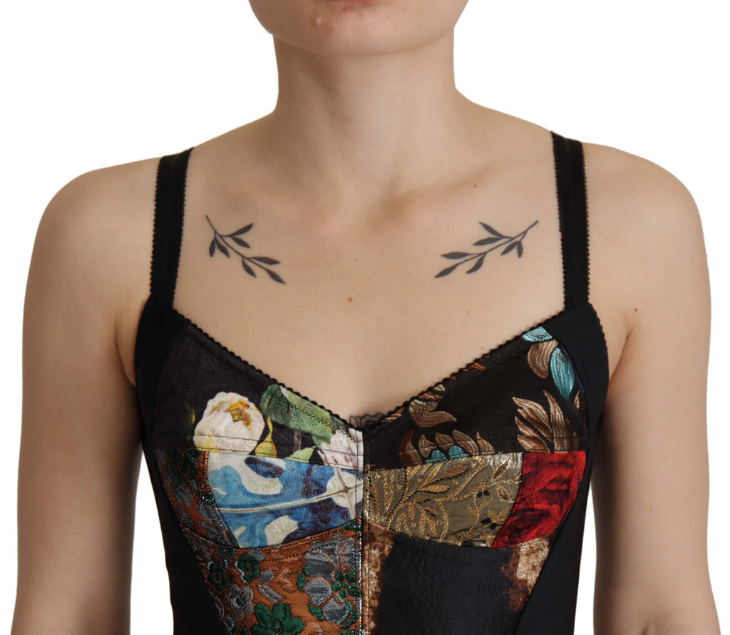 Blouse corset cropped Dolce & Gabbana en patchwork noir avec détails sophistiqués et style élégant.