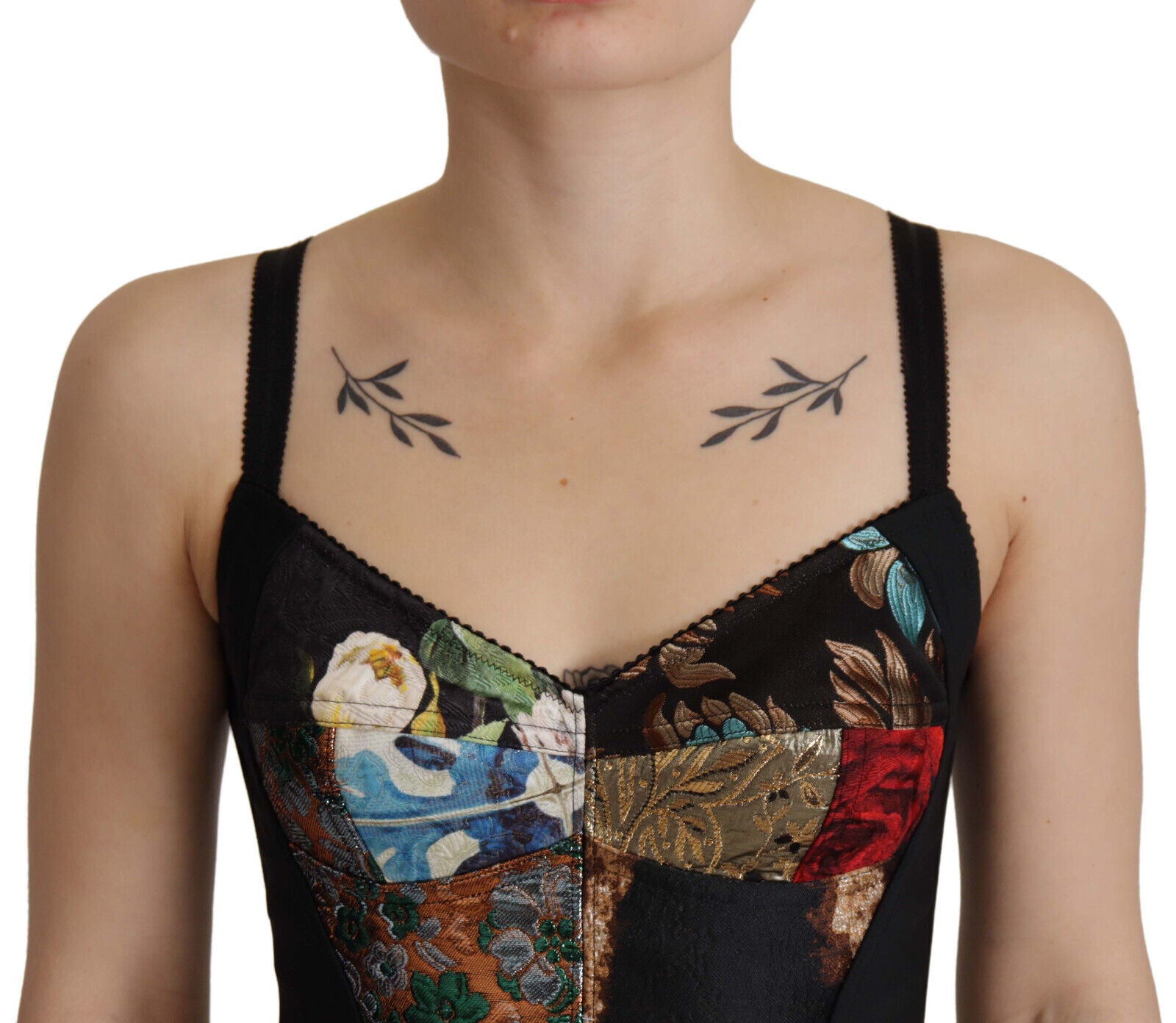 Blouse corset cropped Dolce & Gabbana en patchwork noir avec détails sophistiqués et style élégant.
