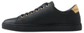 Chaussures sneakers classiques en cuir noir et or Dolce & Gabbana, style élégant avec détails en or, vue de face.