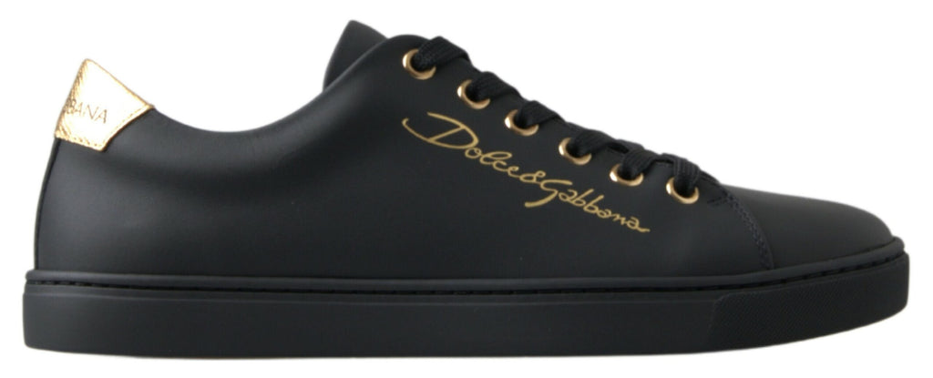 Chaussures sneakers classiques en cuir noir et or de Dolce & Gabbana, style élégant et sophistiqué.