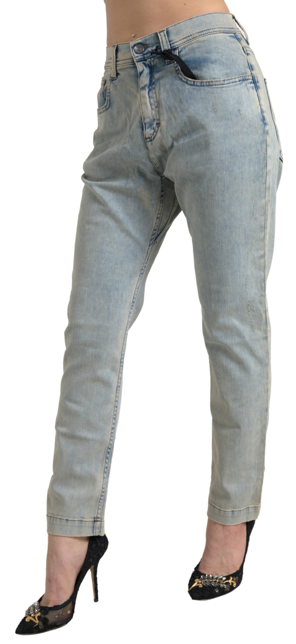 Jeans skinny en coton délavé bleu de mi taille de Dolce & Gabbana, visible avec détails de couture et coupe ajustée.