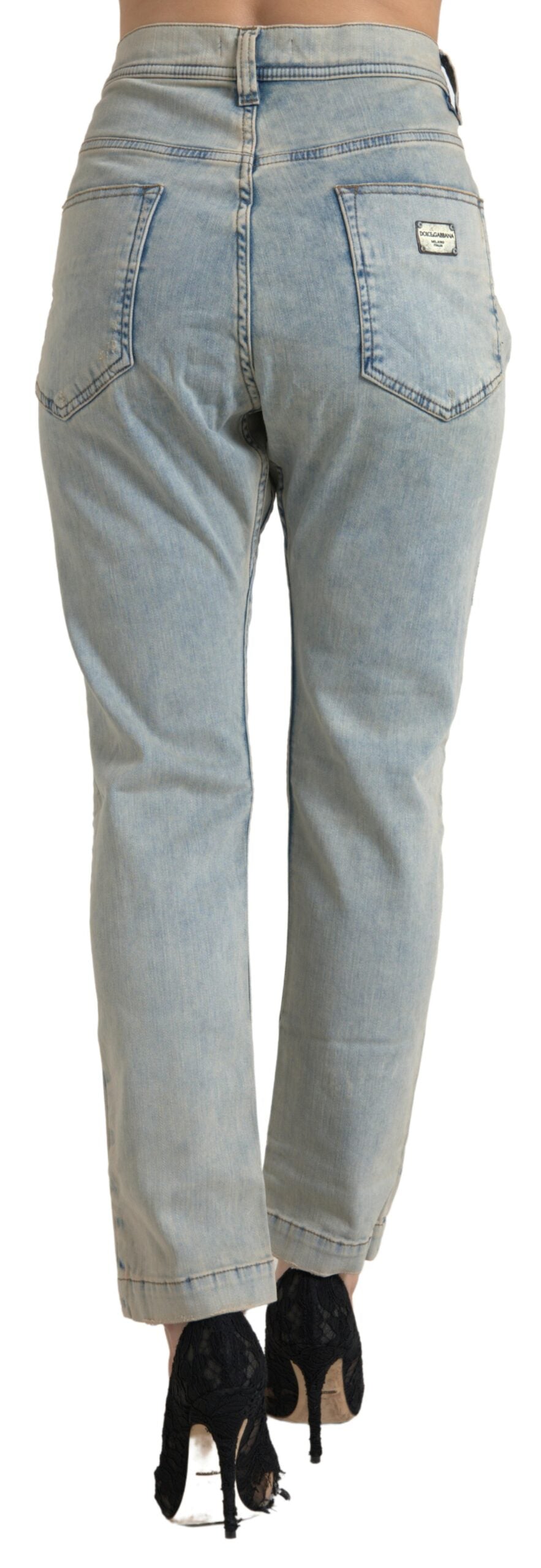 Jean skinny en coton bleu délavé Dolce & Gabbana, taille mi-haute, ajusté, visible avec détails de couture et poches.