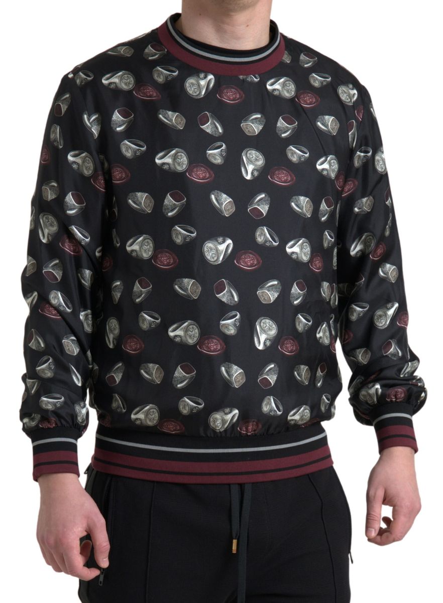 Pull en soie noir Dolce & Gabbana avec motif anneau, col ras du cou, élégant et confortable, pour un style sophistiqué.